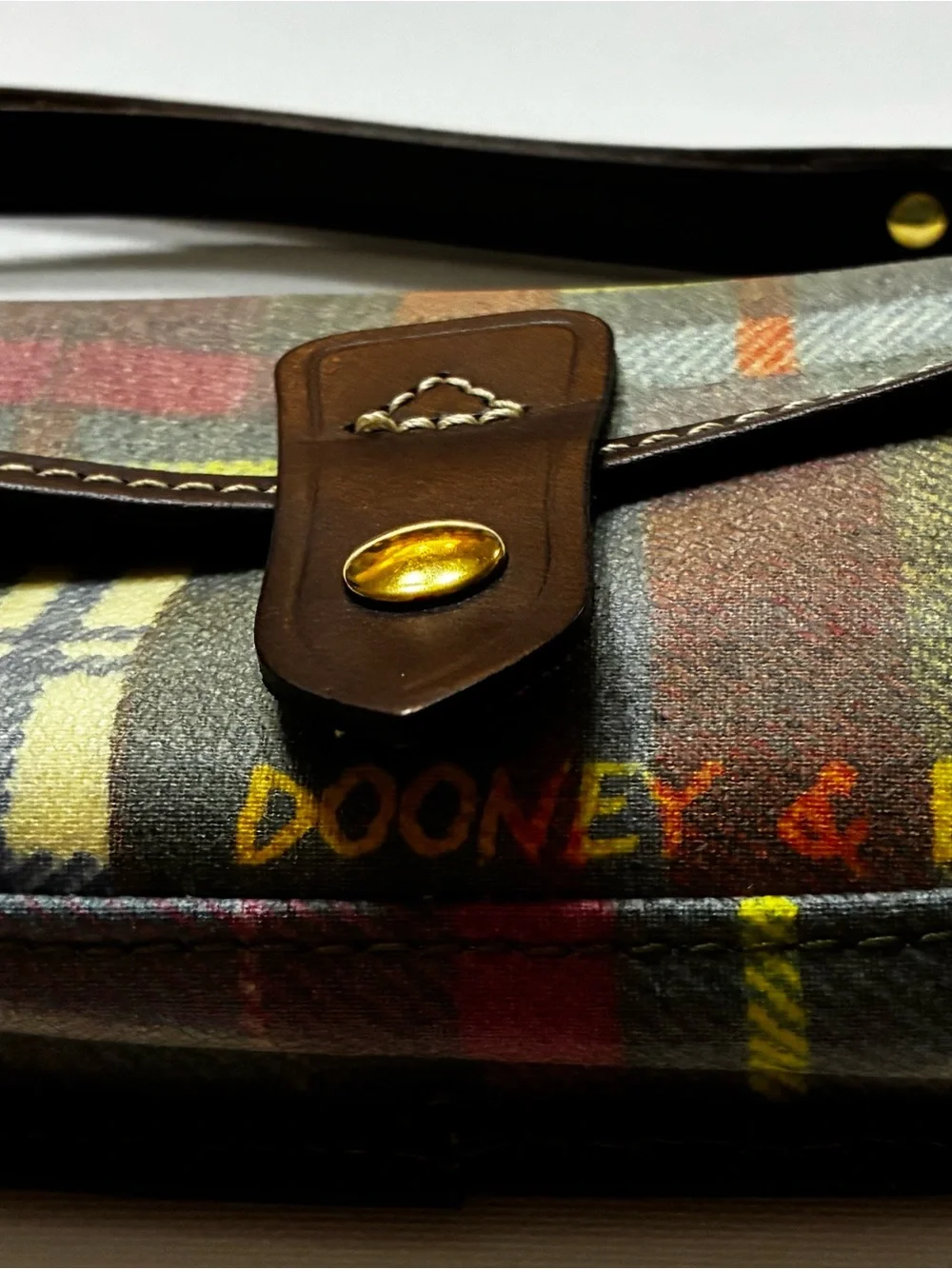 Dooney & Bourke  EUC Multicolor Plaid Crossbody Logo Charm Brown  Leather Strap